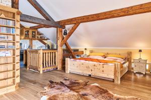 a bedroom with a bed and a book shelf at Appartement Alpine Affair in Bad Feilnbach