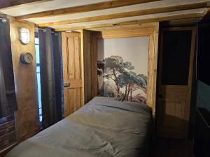 a small bedroom with a bed in a room at Shoreditch Heights- Central ground floor apartment in Exeter
