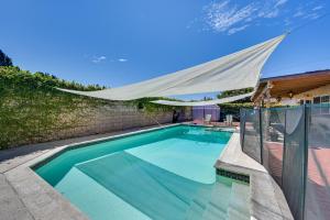 uma piscina com um dossel sobre ela em Chula Vista Vacation Rental with Private Pool and Spa! em Chula Vista