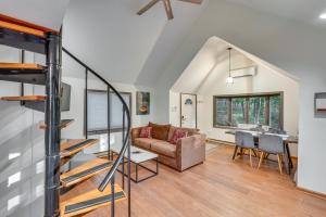 a living room with a couch and a table at South Salem Vacation Rental with Furnished Deck! in South Salem