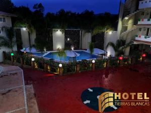 a hotel with a swimming pool at night at Hotel Tierras Blancas in Valle de Bravo