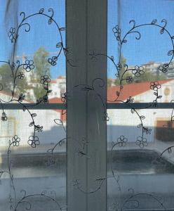 a window with a view of a street at Casa da Levada in Tomar