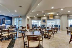 a dining room with tables and chairs at Drury Inn & Suites Sikeston in Sikeston