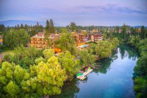 an aerial view of a resort on a river at The Pine Lodge on Whitefish River, Ascend Hotel Collection in Whitefish