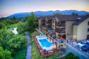 an aerial view of a house with a swimming pool at The Pine Lodge on Whitefish River, Ascend Hotel Collection in Whitefish