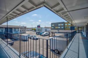 a balcony with a view of a parking lot at Studio 6 Eureka CA Old Town in Eureka