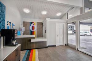 a lobby with a colorful stripe on the floor at Studio 6 Eureka CA Old Town in Eureka