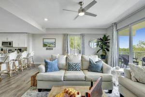 a living room with a couch and a table at Mangrove Magic in Little Harbor Resort & Marina in Ruskin