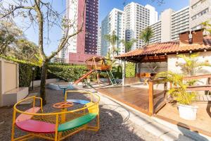 a park with a playground and a swing at Edifício Milena in Curitiba