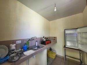 a kitchen with a sink and a counter top at Edén in Tarija