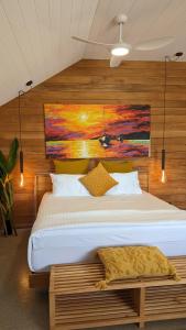 Postel nebo postele na pokoji v ubytování Bombua Beach House