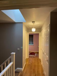 a hallway with a skylight in a house at Southend Lane Suites in Forest Hill