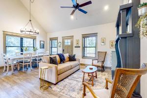 a living room with a couch and a table at Firefly Meadows in Ellijay