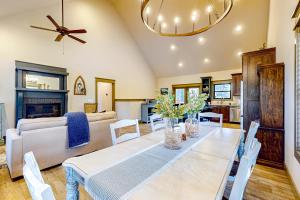 a dining room with a table and a couch at Firefly Meadows in Ellijay