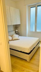 Een bed of bedden in een kamer bij [Portofino] Terrace & Garden