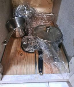 a wooden cutting board with a bowl and a knife at Private 1 Bedroom shared house in La Ceiba
