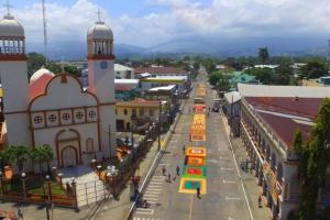 a city street with a clock tower in a town at Private 1 Bedroom shared house in La Ceiba