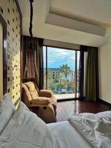 Postel nebo postele na pokoji v ubytování Golden Tulip Jineng Resort Bali