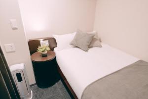 Voodi või voodid majutusasutuse R Hotel Honmachi toas