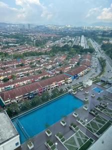 an aerial view of a city with a pool at INAP DESA EVO BANGI in Bandar Baru Bangi