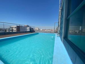a swimming pool on the roof of a building at Precioso Departamento en Caballito in Buenos Aires