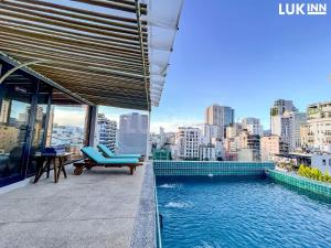 a swimming pool on the roof of a building at LUK Inn Hotel - An Thượng, Đà Nẵng in Da Nang