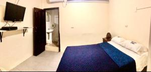 Postel nebo postele na pokoji v ubytování Veranera Hostal