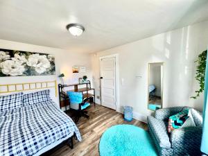 a bedroom with a bed and a chair and a desk at Private Room with Shared Bathroom 10 mins by car to Airport and 15 mins to Downtown Seattle in Seattle