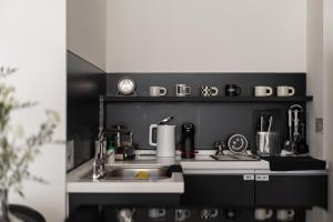 Η κουζίνα ή μικρή κουζίνα στο 双層公寓 Duplex Apt.