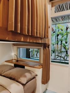 Ein Bett oder Betten in einem Zimmer der Unterkunft Kos One Hostel