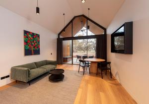 a living room with a couch and a table at Par Five Shacks in Berri