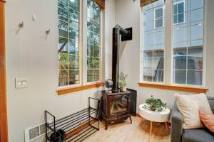 a living room with a wood stove and a couch at Modern 3Bed+loft, 3.5Bath Home w/desk, gym access in Seattle