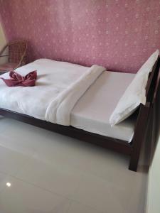 Una cama o camas en una habitación de Hotel Green Hill View