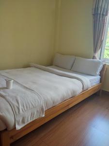 Una cama o camas en una habitación de Hotel Green Hill View
