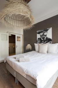 Кровать или кровати в номере Smartflats City - Manneken Pis