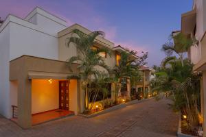 an empty street in front of a building at 3 Solace3 BR PvtPool Villa wCook Candolim Goa in Candolim