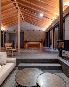 a living room with a couch and a table at MONS GORA Luxury Private Villa with Onsen Hakone Gora in Hakone