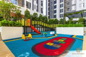 a playground with a slide in a city at Sentral Suites Kuala Lumpur, Five Senses in Kuala Lumpur
