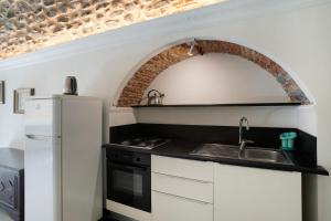 Una cocina o cocineta en La credenza, borgo dei pescatori