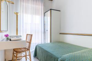 Posteľ alebo postele v izbe v ubytovaní Hotel Il Telamonio