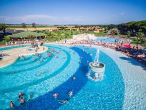 an overhead view of a water park with people swimming at Gitavillage California in Montalto di Castro