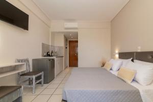 Postel nebo postele na pokoji v ubytování Daisy Hotel