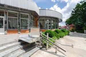 a building with a bench in front of it at Tisa Hotel in Kyiv