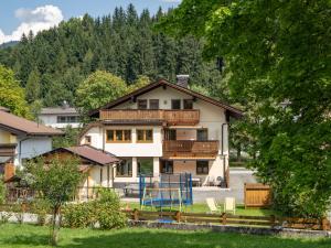 a large house with a balcony on top of it at Haus Alton - Fieberbrunn inkl Lauchsee Eintritt in Fieberbrunn