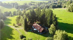 an aerial view of a house in a field at Bohemian forest paradise 