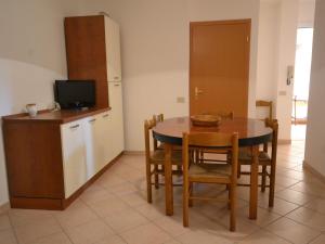a kitchen and dining room with a table and chairs at Simplistic Holiday Home in Sciacca near Horse Riding in Sciacca