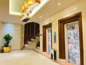 a hallway with a staircase in a building at Palace Hotel Saigon in Ho Chi Minh City