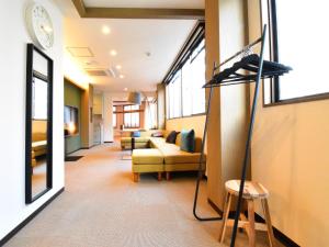 a room with a room with a living room with a microphone at The Garden Place Hiroshima - Vacation STAY 89703v in Hiroshima