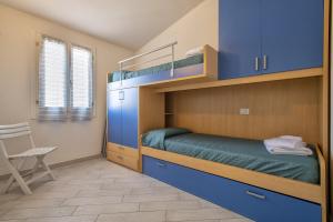 Ένα ή περισσότερα κρεβάτια σε δωμάτιο στο Baia delle mimose vista mare