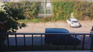 a car and a van parked in a parking lot at SELF CHECK-IN TARGI LOTNISKO PARKING b in Poznań